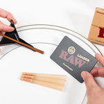 Scoop Card and cone loader on a plate with three raw cones